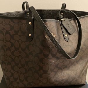 Authentic coach reversible bag/wristlet Black and Signature Print Brown